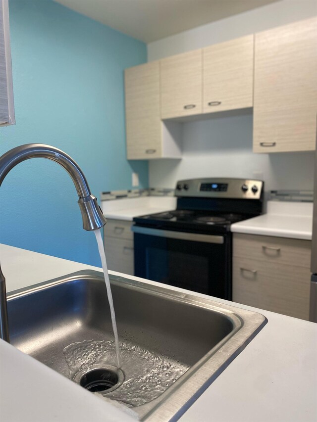 480 Kenolio Rd Unit 23-202, Kihei, HI 96753 - kitchen featuring stainless steel range with electric cooktop and light countertops