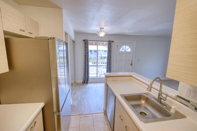 480 Kenolio Rd Unit 23-202, Kihei, HI 96753 - kitchen featuring freestanding refrigerator, light countertops, and stainless steel dishwasher