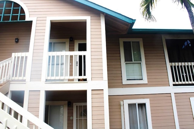 view of side of home with a balcony