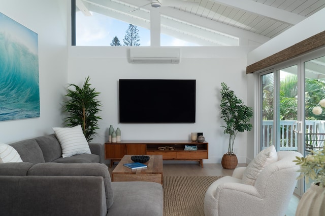 living room featuring lofted ceiling with beams, plenty of natural light, an AC wall unit, and wood finished floors