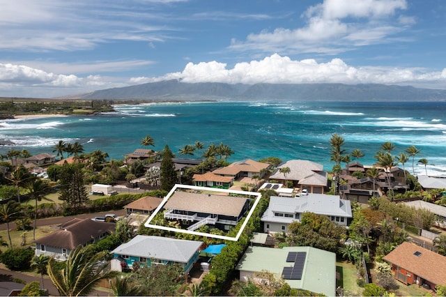 drone / aerial view with a residential view and a water and mountain view