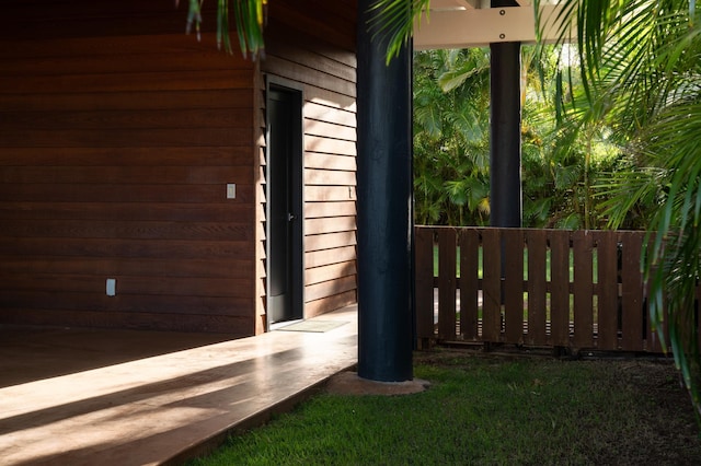view of side of home with fence