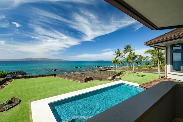 view of pool featuring a water view and a lawn