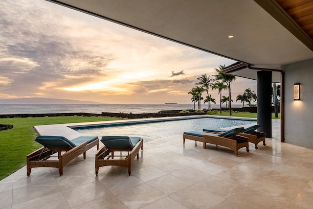 patio terrace at dusk with a water view