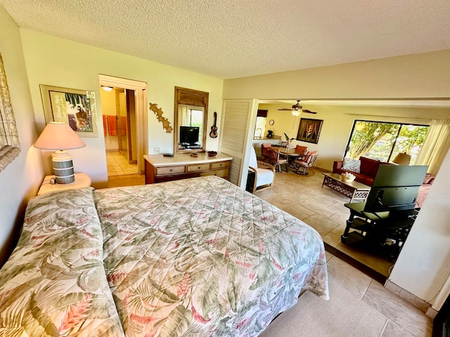 bedroom featuring light tile flooring, vaulted ceiling, and a textured ceiling