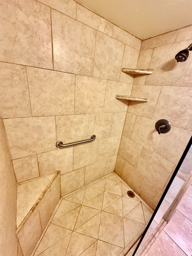 bathroom with a tile shower