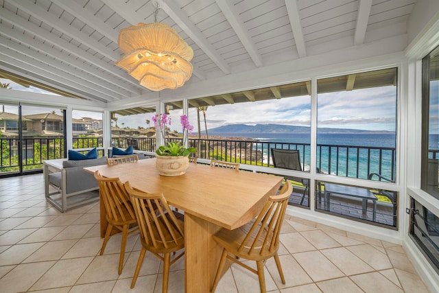 sunroom / solarium with wood ceiling, a water and mountain view, and lofted ceiling with beams