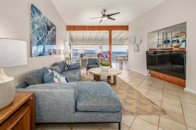 tiled living room with ceiling fan