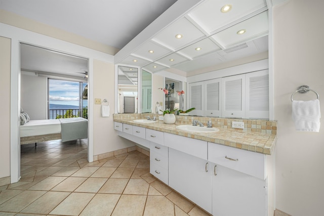 bathroom featuring tile patterned flooring, vanity, decorative backsplash, and coffered ceiling