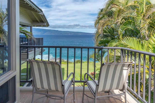 balcony with a water and mountain view