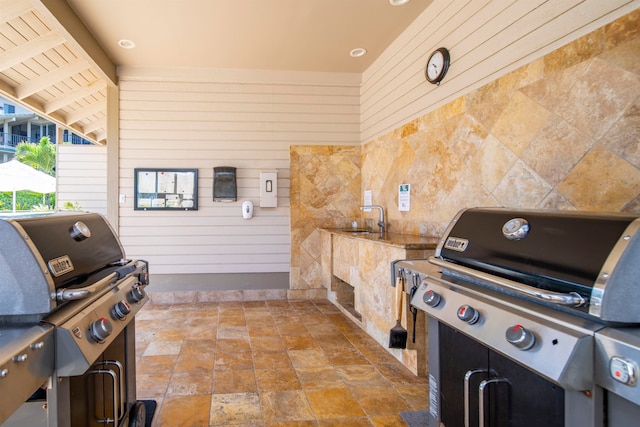 view of patio / terrace with grilling area and sink