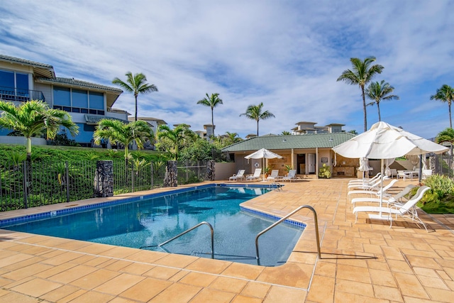 view of swimming pool featuring a patio area