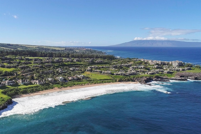 birds eye view of property with a water and mountain view