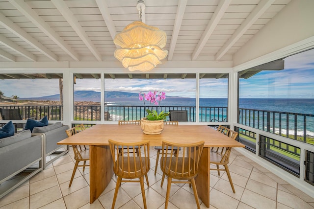 sunroom with wood ceiling, a water and mountain view, and a chandelier