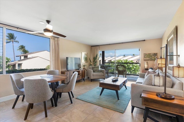 tiled living room with ceiling fan