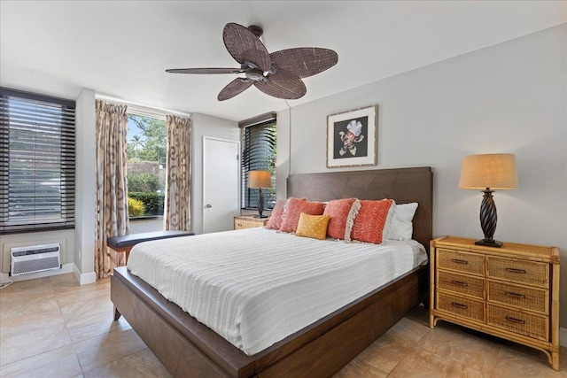 bedroom featuring ceiling fan, light tile patterned flooring, and a wall mounted air conditioner