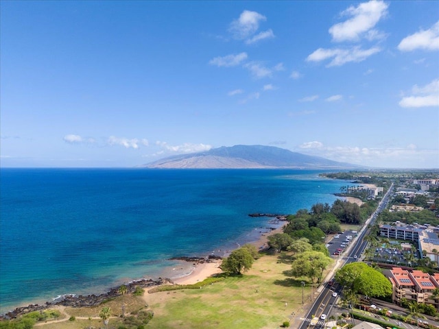 drone / aerial view with a water and mountain view