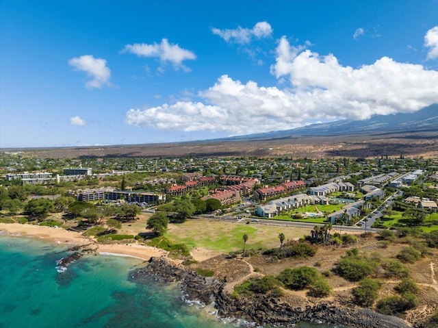 bird's eye view featuring a water view and a beach view