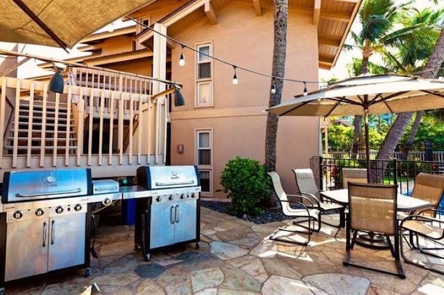 115 N Kihei Rd Unit A3, Kihei, HI 96753 - view of patio / terrace featuring stairs, outdoor dining area, and area for grilling