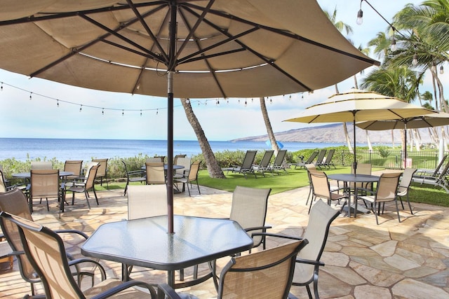 115 N Kihei Rd Unit A3, Kihei, HI 96753 - view of patio / terrace featuring outdoor dining area and a water view