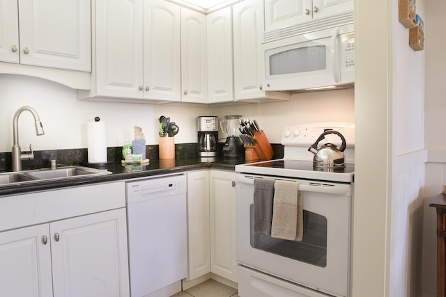 115 N Kihei Rd Unit A3, Kihei, HI 96753 - kitchen with white appliances, white cabinetry, and dark countertops