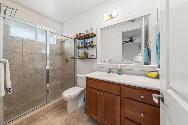 bathroom featuring an enclosed shower, vanity, toilet, and tile patterned flooring