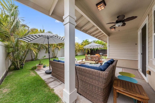 view of patio / terrace featuring ceiling fan and an outdoor living space