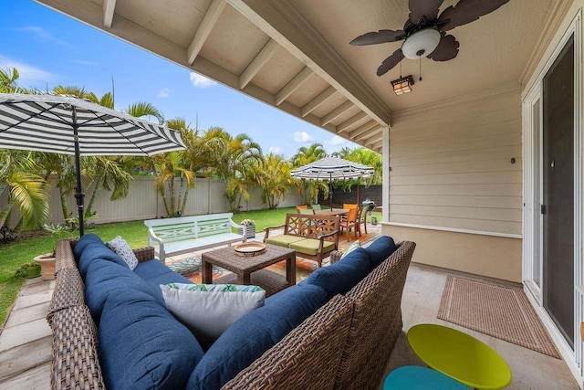 view of patio with an outdoor living space and ceiling fan