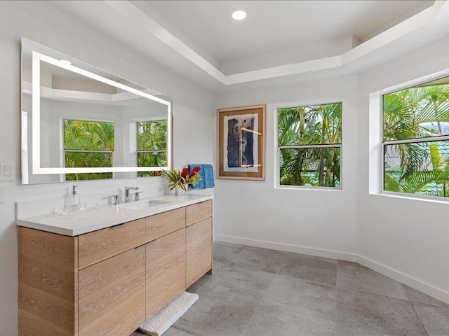 bathroom featuring vanity and a raised ceiling