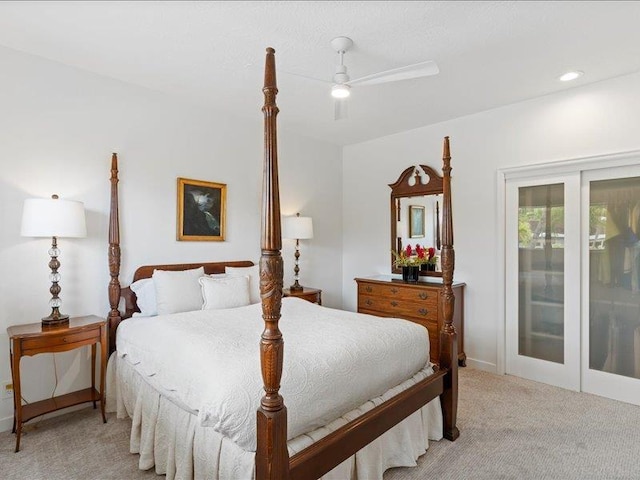 carpeted bedroom with ceiling fan and access to outside