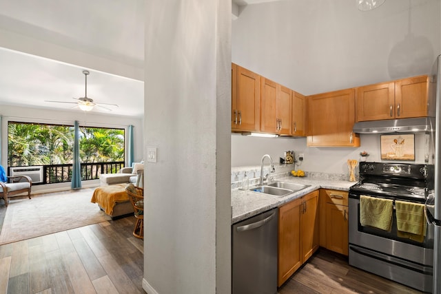 15 Kulanihakoi St Unit 9F, Kihei, HI 96753 - kitchen with appliances with stainless steel finishes, a sink, under cabinet range hood, open floor plan, and dark wood-style floors