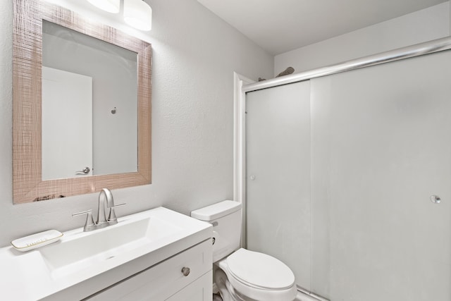 15 Kulanihakoi St Unit 9F, Kihei, HI 96753 - bathroom with a shower stall, toilet, and vanity