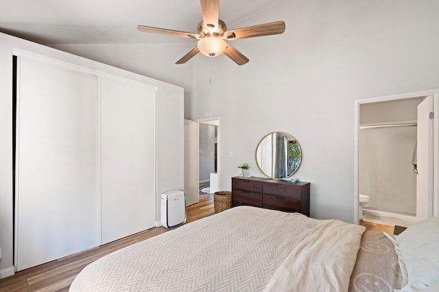 15 Kulanihakoi St Unit 9F, Kihei, HI 96753 - bedroom with light wood-type flooring, ensuite bath, a closet, high vaulted ceiling, and a ceiling fan