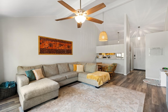 15 Kulanihakoi St Unit 9F, Kihei, HI 96753 - living room featuring beam ceiling, wood finished floors, ceiling fan, high vaulted ceiling, and baseboards