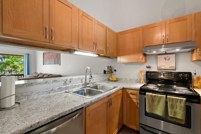 15 Kulanihakoi St Unit 9F, Kihei, HI 96753 - kitchen with appliances with stainless steel finishes, a sink, under cabinet range hood, and light countertops