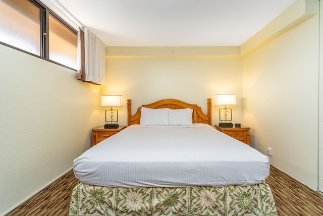 bedroom featuring dark wood-type flooring