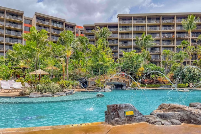 view of swimming pool featuring pool water feature