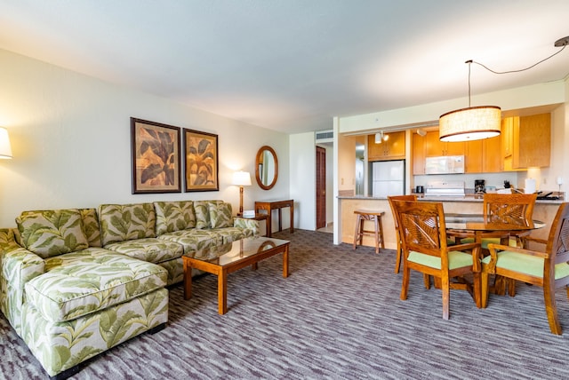 view of carpeted dining space