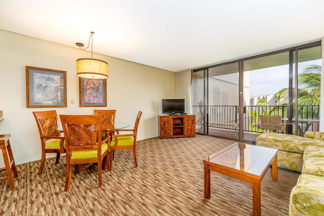 carpeted dining area featuring a wall of windows