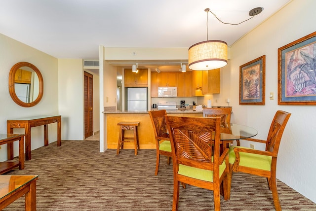 view of carpeted dining space