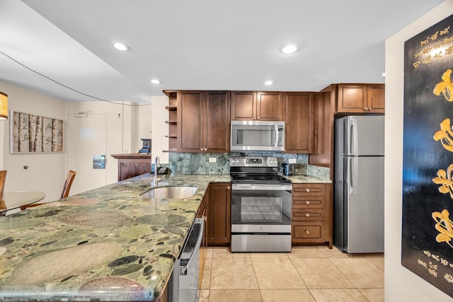 3445 Lower Honoapiilani Rd Unit 311, Lahaina, HI 96761 - kitchen featuring stainless steel appliances, a sink, open shelves, light tile patterned flooring, and a peninsula