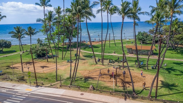 view of community featuring a yard and a water view