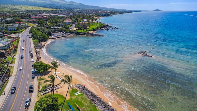 aerial view with a water view and a beach view