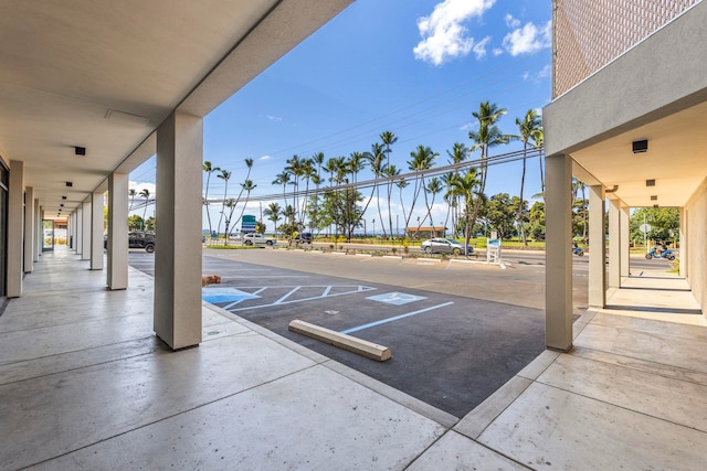 view of community with uncovered parking