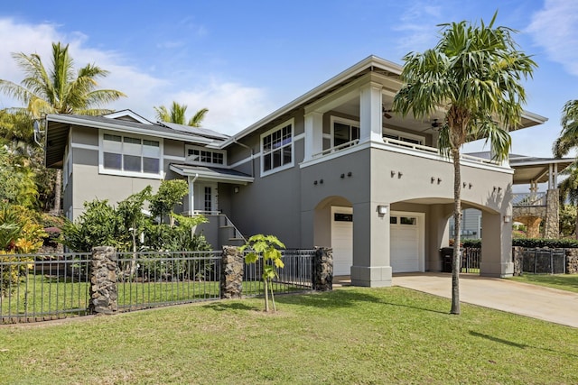 view of front of home with a garage, a front yard, and a balcony