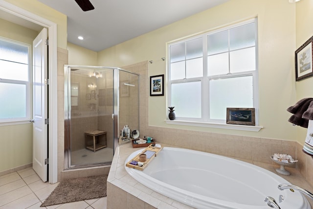 bathroom featuring tile patterned flooring, plus walk in shower, and ceiling fan