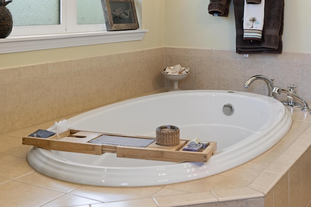 bathroom featuring tiled bath