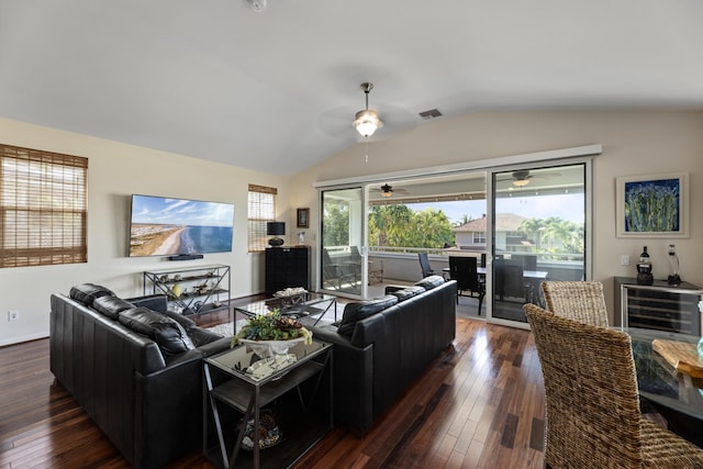 living room with lofted ceiling, dark hardwood / wood-style floors, and ceiling fan