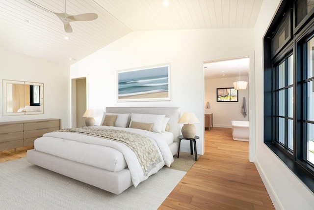 bedroom with lofted ceiling, wooden ceiling, light wood-style flooring, and ensuite bath