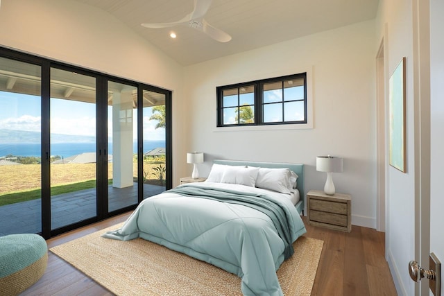 bedroom featuring lofted ceiling, recessed lighting, ceiling fan, wood finished floors, and access to outside